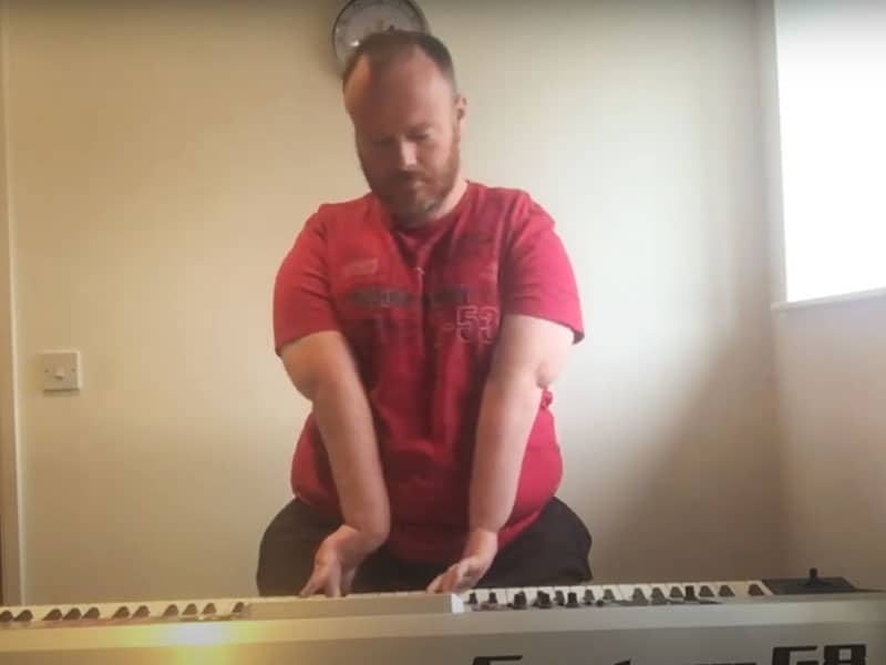 Man with disability plays piano