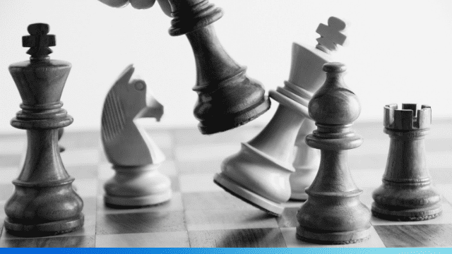 chess pieces and one knocked over