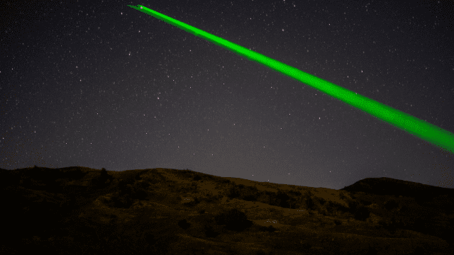 Laser through the night sky