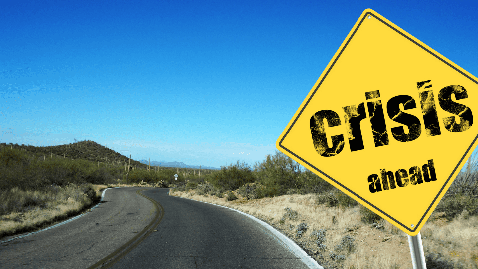 Crisis sign and a road