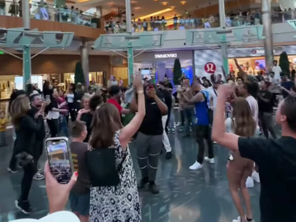 A crowd of people worshiping and praying at Millenia Mall before being banned
